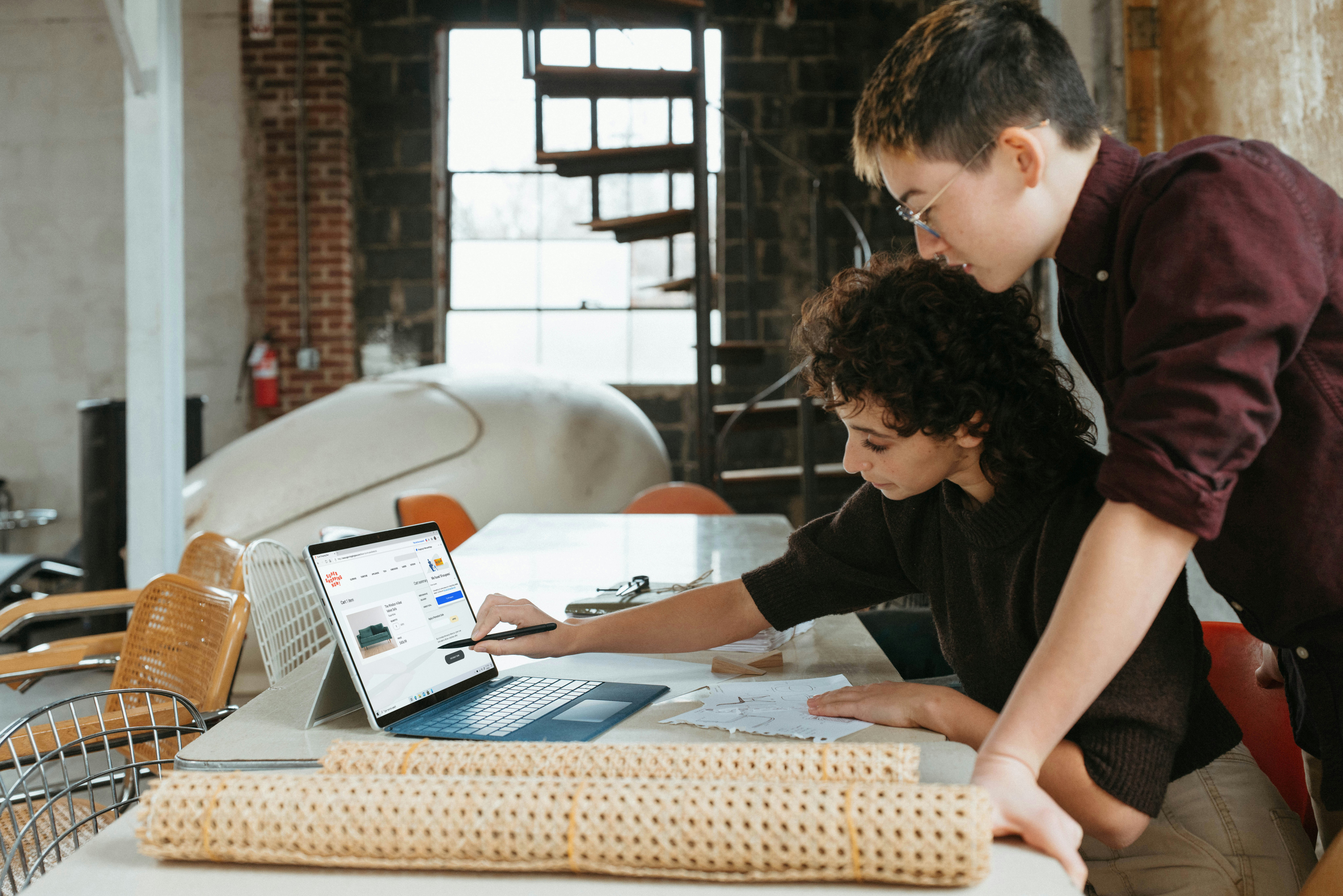 Woman Teaching how to use Tool on Computer - AI Tools for Small Businesses