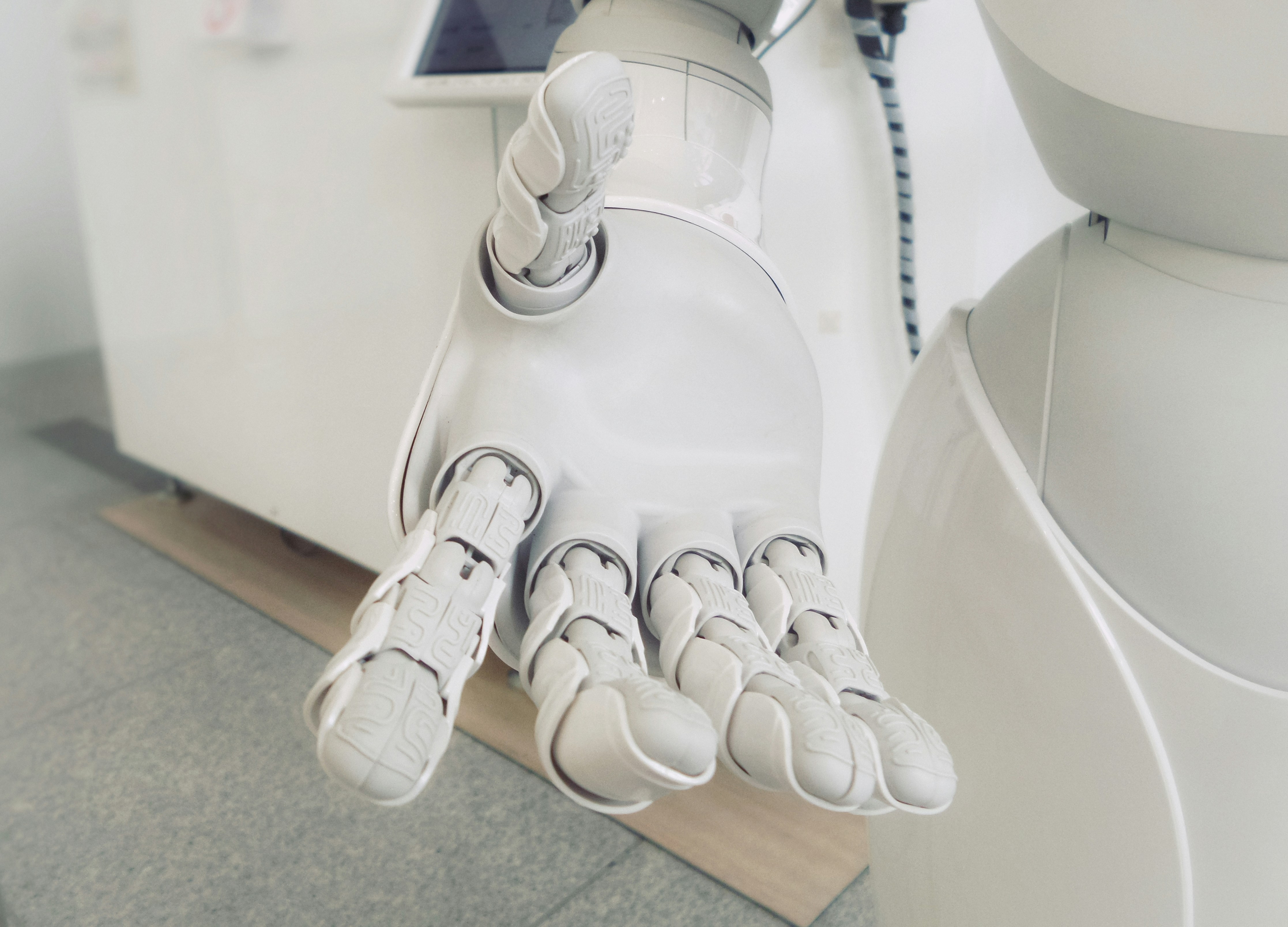 Picture Showing a Robot Hand- What Can AI Help Me With