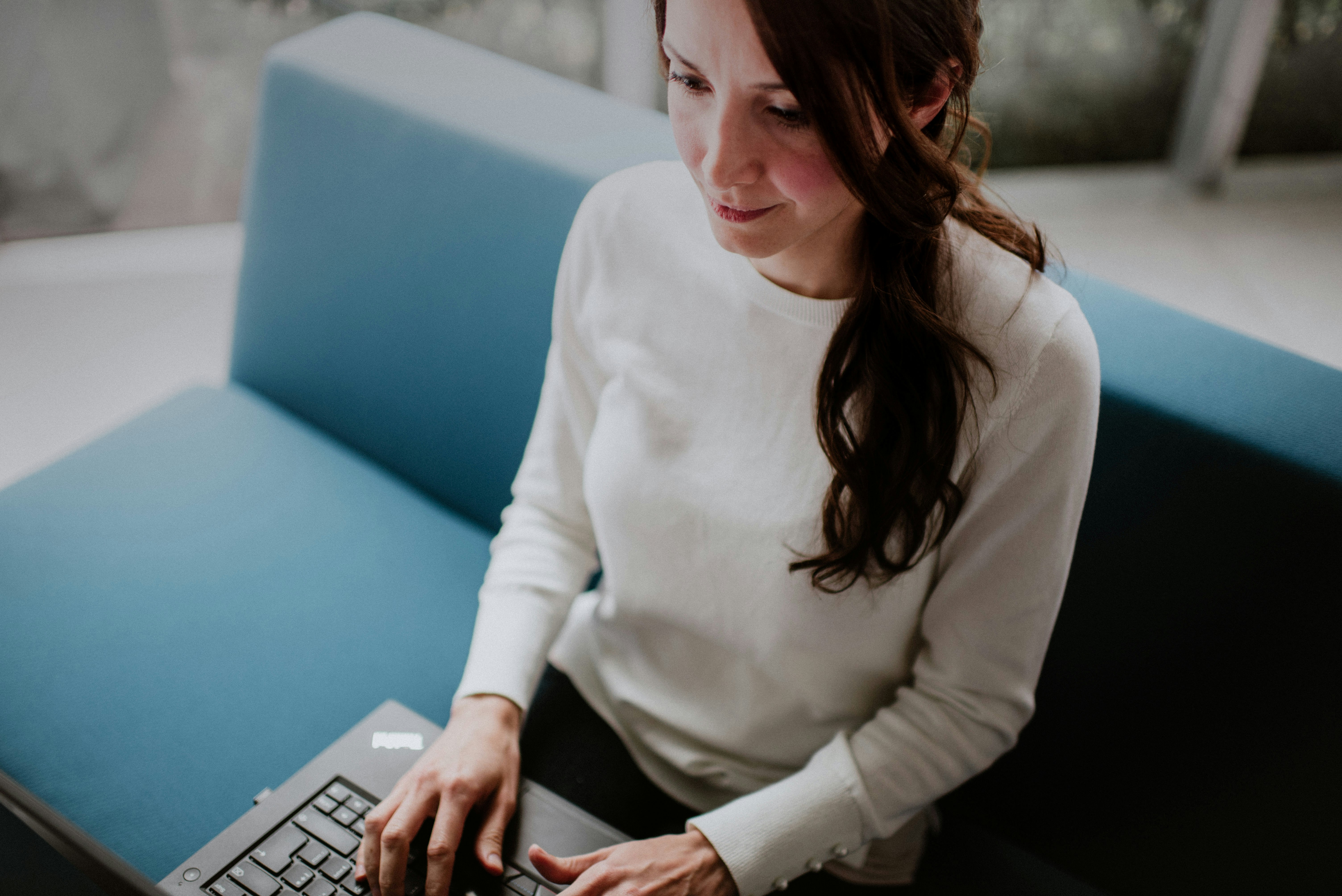 woman working with AI Business Description Generator