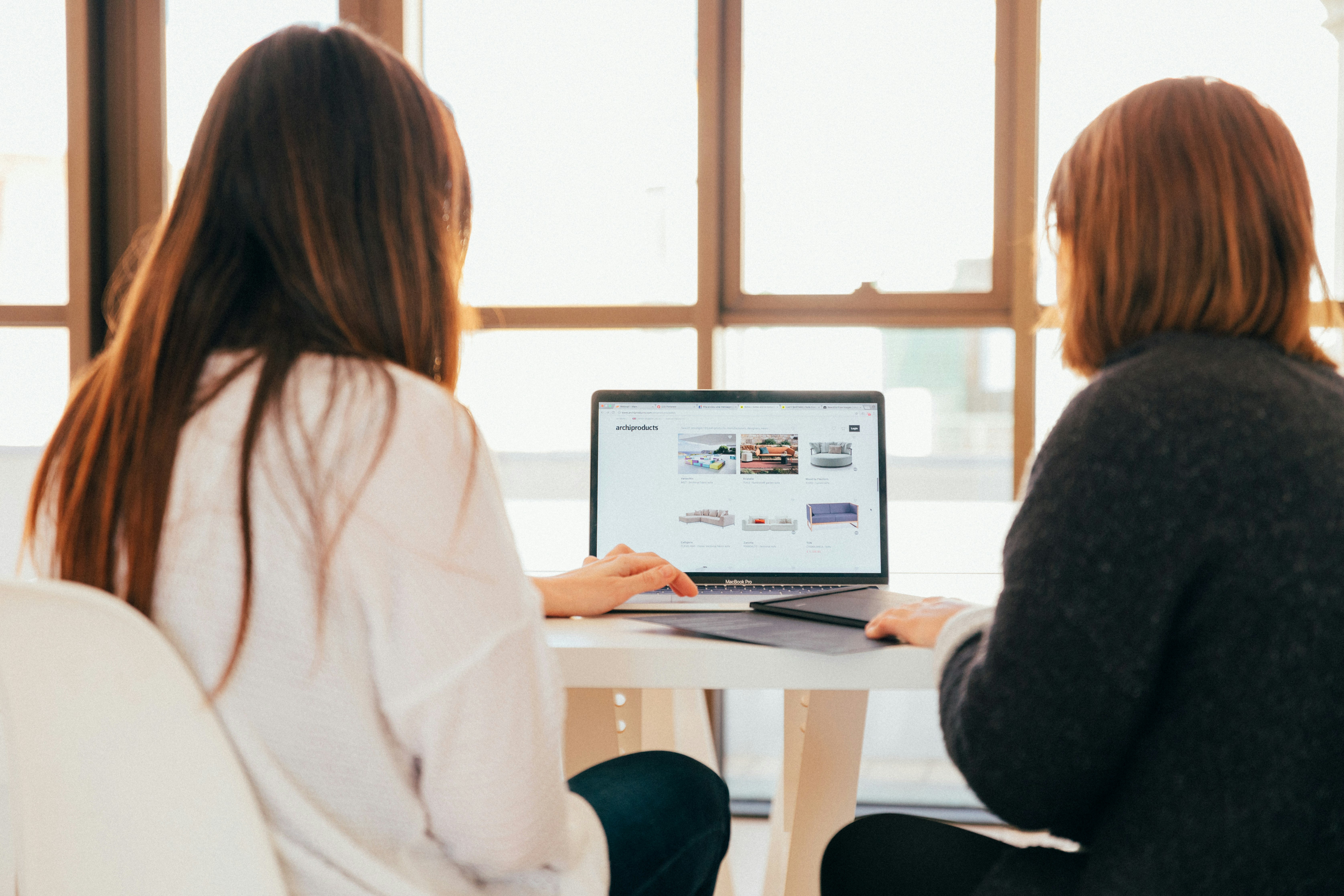 girl designing a Product Detail Page on a laptop