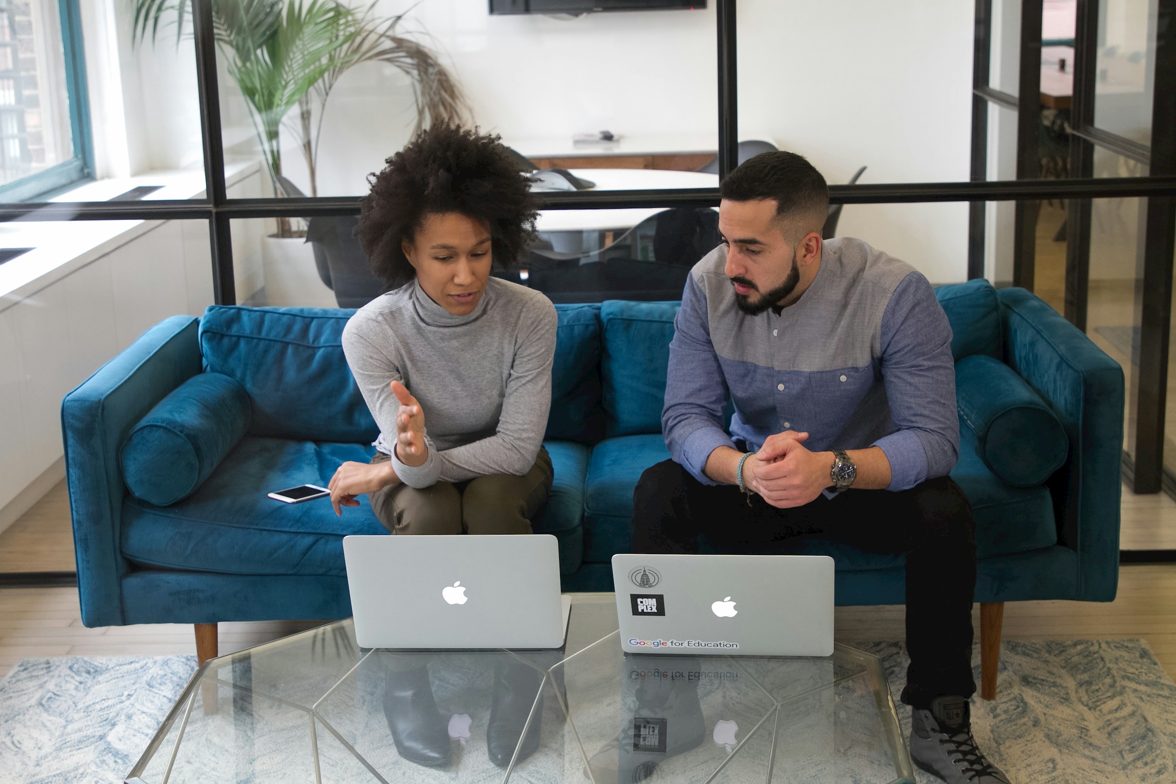 team with laptop - How to Use Gemini in Google Sheets