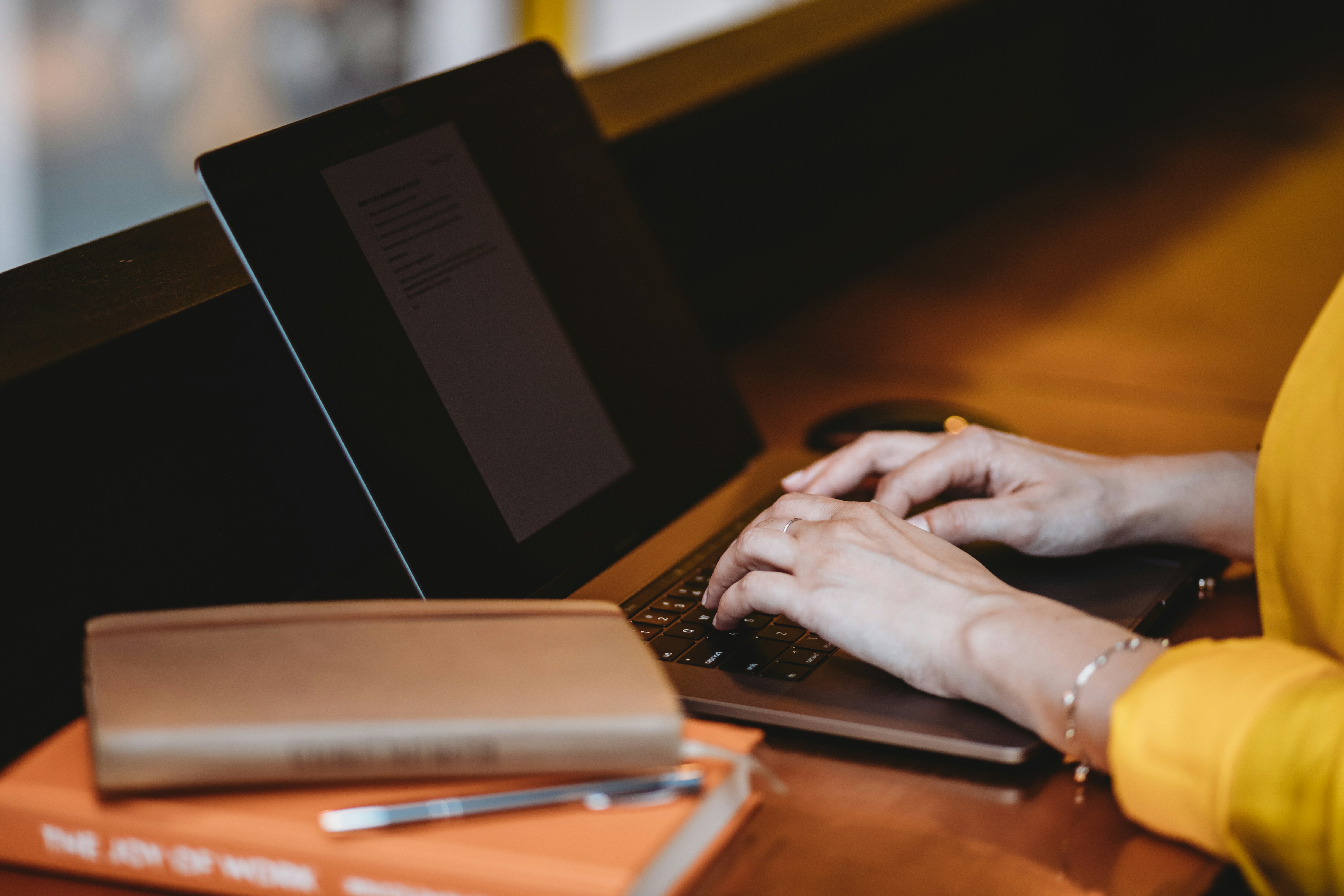 woman typing in new content by Using ChatGPT for SEO